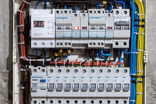 Voltage switchboard with circuit breakers are in the ON and OF positions in the big electric box for electrical distribution panel, and temporary electric cables are switched.